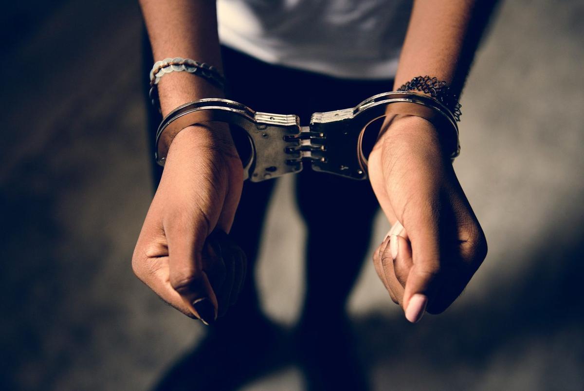 girl hands in handcuffs