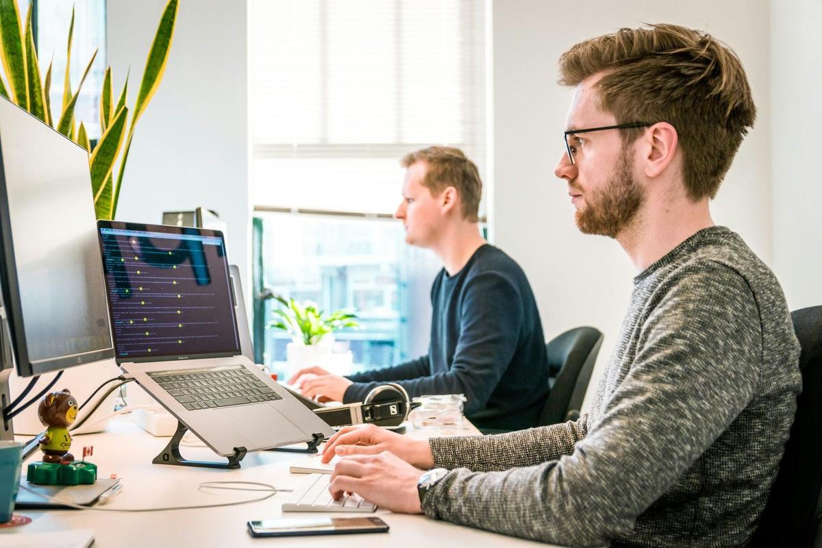 An image of people working in an office being aware of cyber security