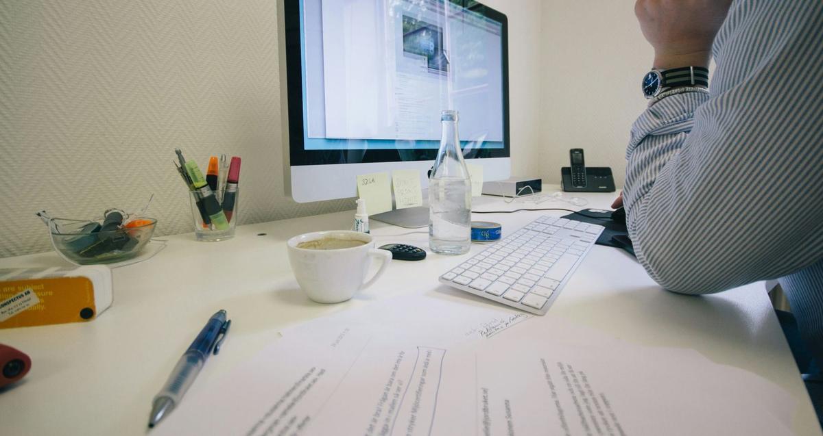 An image of a Barristers clerk working at the desk