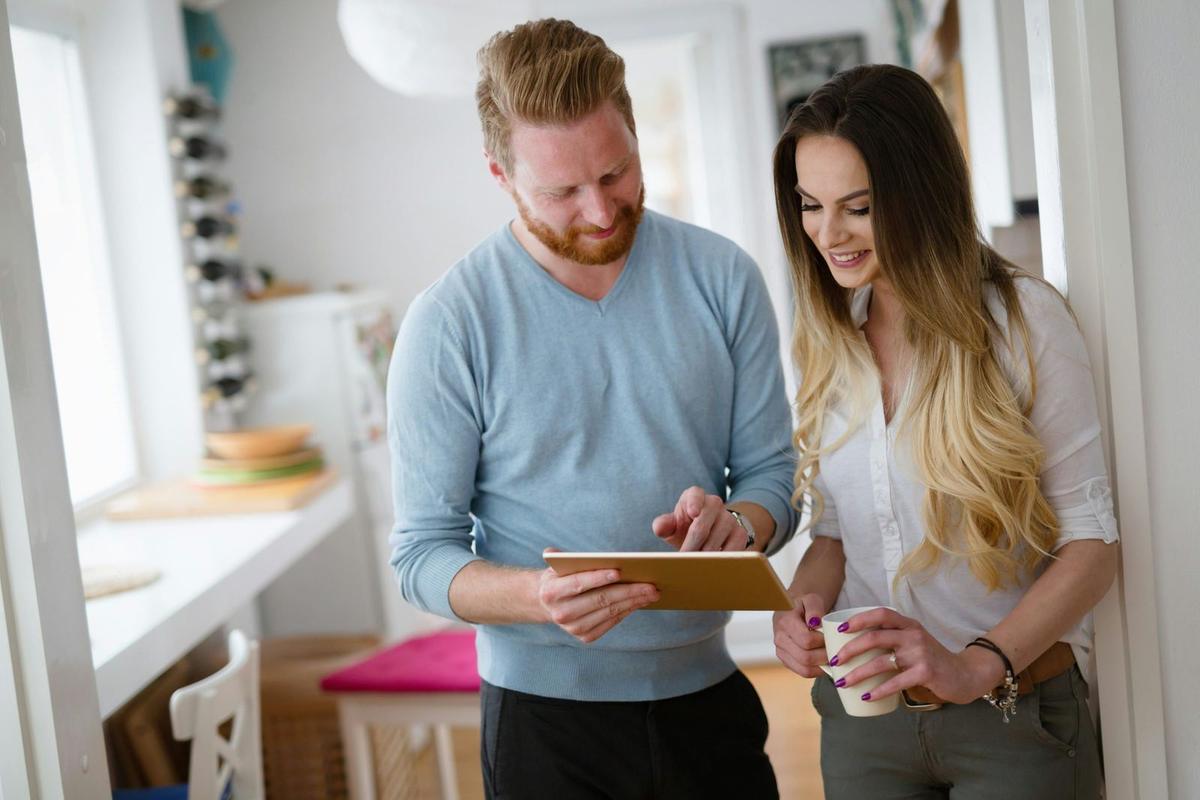 An image of a man and woman looking at their to do list