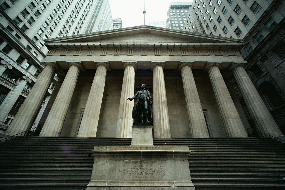 Statue of a man in front of a building