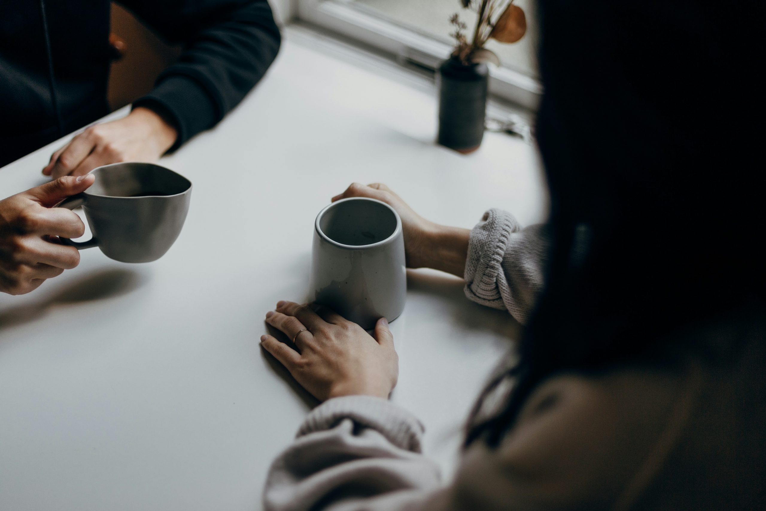 An image of two people having coffee