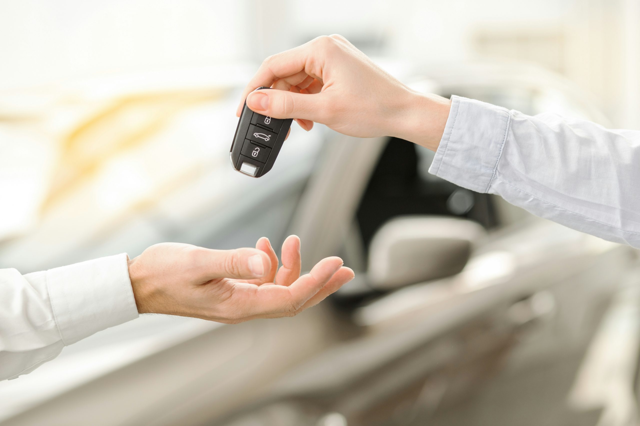 An image of hands exchanging car keys symbolising data breach at car hire